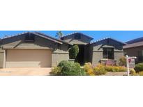 Charming single-Gathering home with desert landscaping, two-car garage, and welcoming front porch at 6301 S Four Peaks Pl, Chandler, AZ 85249