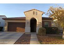 Single-story home with arched entryway and two-car garage at 20496 W Valley View Dr, Buckeye, AZ 85396