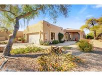 Beautiful desert landscape home with landscaped front yard and two car garage at 27506 N Montana Dr, Rio Verde, AZ 85263