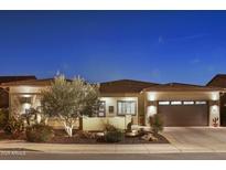 Attractive single-story home with desert landscaping and a three-car garage at 29512 N Tarragona Dr, Peoria, AZ 85383