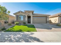 One-story home with a two-car garage and landscaped front yard at 3419 W Dreamy Draw Dr, San Tan Valley, AZ 85144