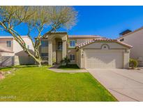 Two-story house with a large front yard and attached garage at 3947 N Carnation Ln, Avondale, AZ 85392