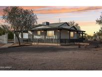 Stunning ranch house exterior with a large covered porch at 4205 E Peak View Rd, Cave Creek, AZ 85331