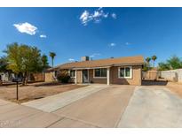 Single-story house with a large front yard and driveway at 5934 W Coronado Rd, Phoenix, AZ 85035