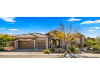 Beautiful two-story home with stone accents and landscaped yard at 6033 E Pebbles Ct, Cave Creek, AZ 85331