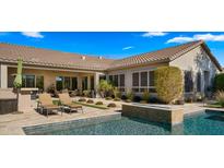 Resort-style pool with fire pit and lounge chairs at 6033 E Pebbles Ct, Cave Creek, AZ 85331