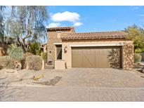 Exterior of a beautiful home with a large garage and desert landscaping at 6231 E Mark Way # 32, Cave Creek, AZ 85331