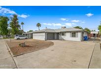 Single story home with attached garage and front yard at 1312 E Colter St, Phoenix, AZ 85014