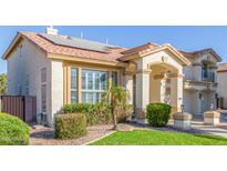 Two-story house with solar panels, landscaped yard, and two-car garage at 1684 E Coconino Dr, Chandler, AZ 85249