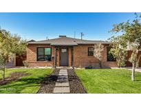 Brick home with landscaped lawn and walkway at 2218 N 8Th St, Phoenix, AZ 85006