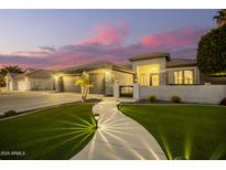 Beautiful two-story home with a three-car garage and landscaped front yard at 22331 N 80Th Ave, Peoria, AZ 85383