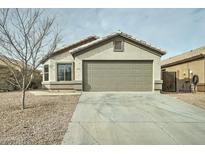 Single-story house with a two-car garage and a gravel driveway at 33868 N Mercedes Dr, San Tan Valley, AZ 85144