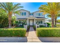 Two-story craftsman home with landscaped yard and brick walkway at 4643 E Montecito Ave, Phoenix, AZ 85018