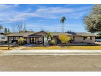 Single story home with landscaped yard and two-car garage at 537 W El Caminito Dr, Phoenix, AZ 85021