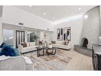 Spacious living room featuring a modern fireplace and stylish furniture at 8779 E Vía De Sereno --, Scottsdale, AZ 85258