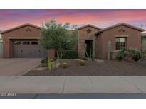 Single-story home with desert landscaping and a two-car garage at 1663 E Vesper Trl, Queen Creek, AZ 85140