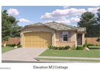 Single-story home with a two-car garage and landscaped front yard at 17590 N Toledo Ave, Maricopa, AZ 85138