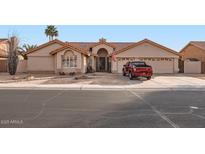 Single-story house with a two-car garage and desert landscaping at 7147 W Voltaire Ave, Peoria, AZ 85381