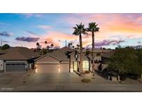 Beautiful two-story home with a three-car garage and desert landscaping at 14848 W Edgemont Ave, Goodyear, AZ 85395