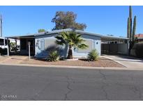 Nice manufactured home with carport and desert landscaping at 303 S Recker Rd # 9, Mesa, AZ 85206