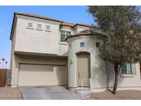 Two-story house with attached garage and neutral color palette at 10332 W Devonshire Ave, Phoenix, AZ 85037
