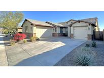 Single-story home with two-car garage and desert landscaping at 18401 W Long Lake Rd, Goodyear, AZ 85338