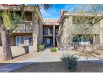 Attractive 2-story condo building with walkway, landscaping, and a staircase at 2929 W Yorkshire Dr # 2091, Phoenix, AZ 85027