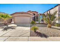 Desert landscape front yard with single story home, two car garage, and neutral color scheme at 29864 N Desert Willow Blvd, San Tan Valley, AZ 85143