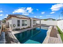 Refreshing pool with spacious patio and backyard at 319 S 227Th Ct, Buckeye, AZ 85326