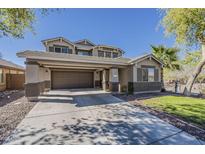 Inviting two-story home featuring desert landscaping, a two car garage, and covered parking at 4275 E Amarillo Dr, San Tan Valley, AZ 85140