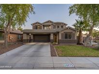 Two-story house with a large front yard and attached garage at 4275 E Amarillo Dr, San Tan Valley, AZ 85140