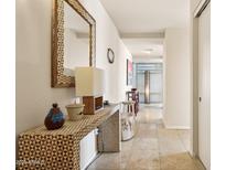 Bright entryway with decorative console table and mirror at 7157 E Rancho Vista Dr # 5006, Scottsdale, AZ 85251