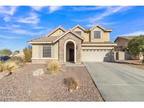 Two-story house with stone accents and a three-car garage at 11506 E Sylvan Ave, Mesa, AZ 85212