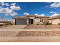 Charming single-story home with a well-manicured front yard and two-car garage at 1176 E Ridgerock St, Casa Grande, AZ 85122