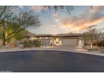 Attractive single-story home with landscaped desert front yard and two-car garage at 14245 N Territory Trl, Fountain Hills, AZ 85268