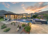 Luxury backyard oasis with a glistening pool, spa, and mountain views at 14245 N Territory Trl, Fountain Hills, AZ 85268