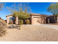 Single-story house with desert landscaping and a two-car garage at 17528 W East Wind Ave, Goodyear, AZ 85338