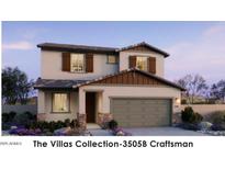 Two-story Craftsman home with gray siding and brown accents at 22327 W Monona Ln, Surprise, AZ 85387