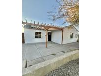 Updated home exterior featuring a pergola and paved patio at 4032 N 11Th Ave, Phoenix, AZ 85013