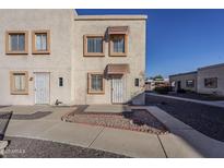 View of the two-story building's exterior, showing the stucco siding and landscaping at 4565 N 26Th Dr, Phoenix, AZ 85017