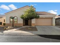 Single-story home with two-car garage and desert landscaping at 4655 E Indigo St, Gilbert, AZ 85298