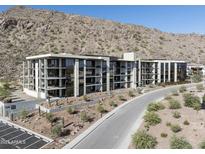 Modern luxury condo building with mountain views and desert landscaping at 5000 E Camelback Ridge Rd # 301, Scottsdale, AZ 85251