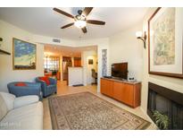 Bright living room with fireplace and comfy seating at 10410 N Cave Creek Rd # 1007, Phoenix, AZ 85020