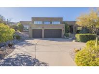 Desert landscape surrounds this two-story home with a large two-car garage at 14944 E Zapata Dr, Fountain Hills, AZ 85268