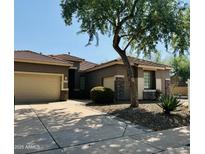 Single-story home with two-car garage and desert landscaping at 35713 N 32Nd Ave, Phoenix, AZ 85086