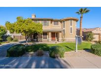 Two-story house with attractive landscaping and a large front yard at 3798 E Latham Ct, Gilbert, AZ 85297