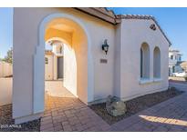 Inviting exterior entrance with arched walkway and brick pavers at 4569 E Waterman St, Gilbert, AZ 85297