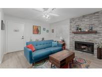 Bright living room with a fireplace and comfortable seating at 1075 E Chandler Blvd # 120, Chandler, AZ 85225