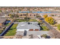 Luxury home with pool and expansive backyard, offering an impressive aerial view at 11243 E Flintlock Dr, Chandler, AZ 85249