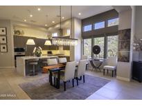 Modern kitchen with island, stainless steel appliances, and white cabinetry at 13767 N Prospect Trl, Fountain Hills, AZ 85268